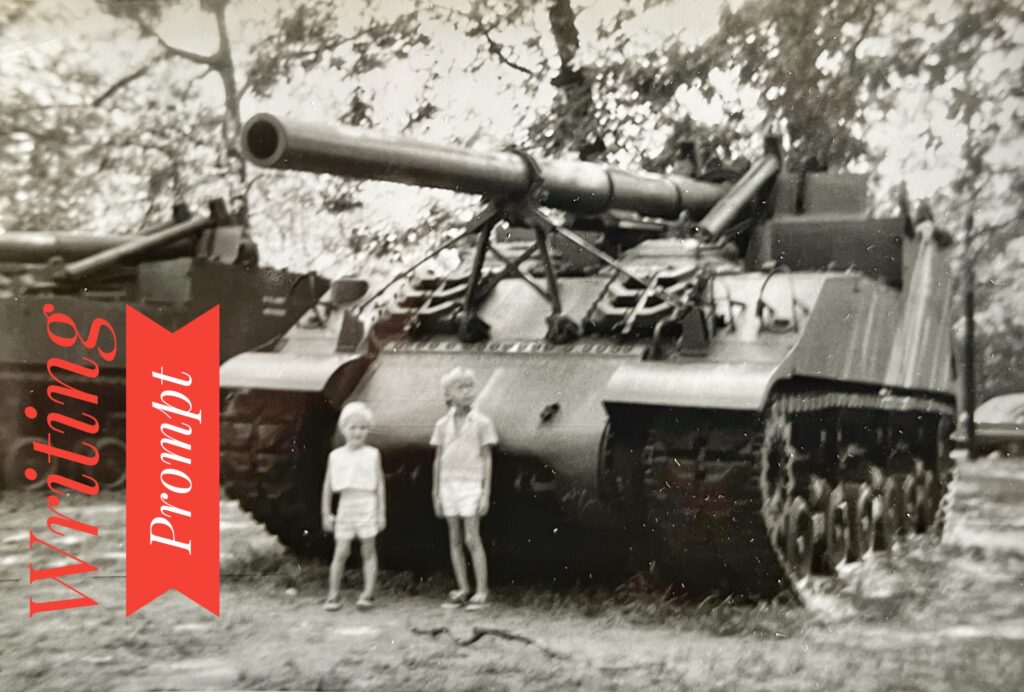 two children in front of WWII tank